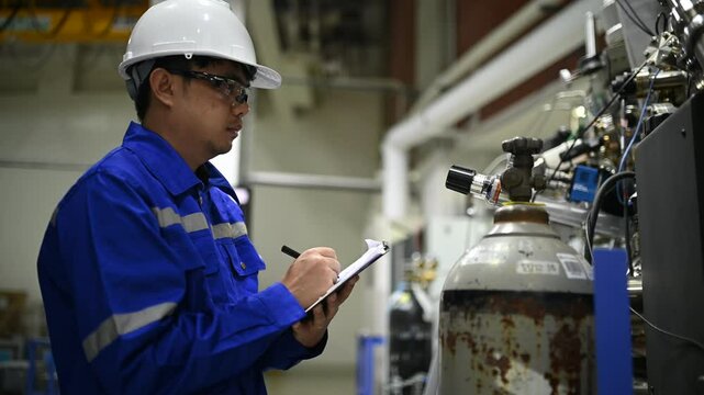 Engineers, technicians, and specialists collaborate in an industrial facility, meticulously handling oxygen tanks, liquid helium containers,and gas systems to ensure safety and efficiency in operation