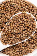 Coriander Grains in a Spoon Top View