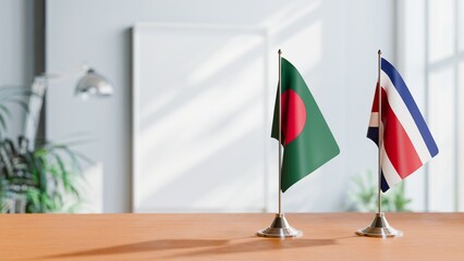 FLAGS OF BANGLADESH AND COSTA RICA ON TABLE