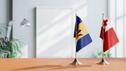 FLAGS OF BARBADOS AND TONGA ON TABLE