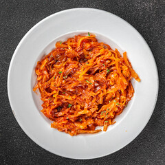 Braised cabbage suerkraut tomato sauce vegetable dish fresh delicious gourmet food background on the table rustick food top view copy space keto and paleo diet vegetarian and vegan food