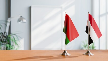 FLAGS OF BELARUS AND YEMEN ON TABLE