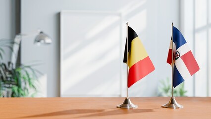 FLAGS OF BELGIUM AND DOMINICAN REPUBLIC ON TABLE