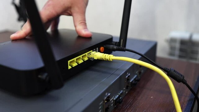 Connecting a router, router to the Internet network via an optical cable - patch cord with an adapter. Operation and reception of a network signal. Equipment for Internet services.