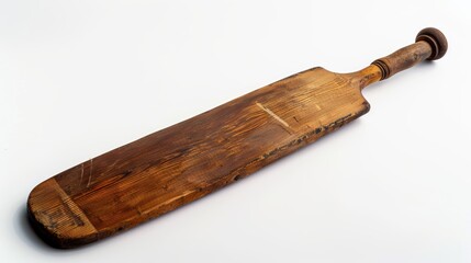 Old wooden cricket bat lying on white background