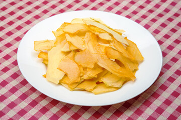 dried pieces of fragrant melon on a plate. vitamin fruit food