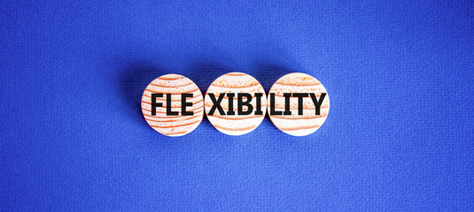 Flexibility symbol. Concept word Flexibility on beautiful wooden circles. Beautiful blue...