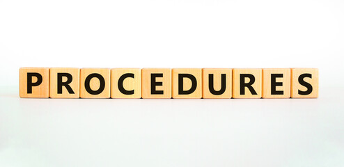 Procedures symbol. Concept word Procedures on beautiful wooden blocks. Beautiful white background. Business procedures concept. Copy space.