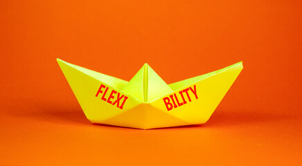 Flexibility symbol. Concept word Flexibility on beautiful yellow paper boat. Beautiful orange...