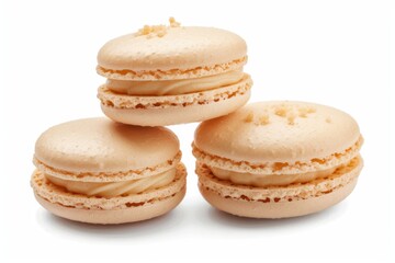 Fototapeta premium Close-up of a peach macarons with creamy filling on a white background. Concept of dessert, pastry, and French cuisine.