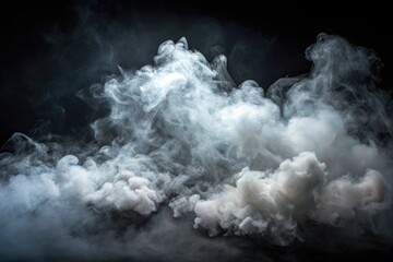 Ethereal fog or smoke isolated on a dark background, with soft, white cloudiness and misty texture, perfect for atmosphere and mood-enhancing designs.