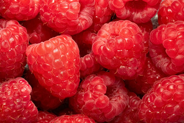 Juicy ripe raspberries close up. Fruity background 