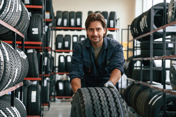 Man is in the tire fitting car service
