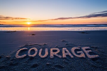 A beach with the word Courage written in the sand