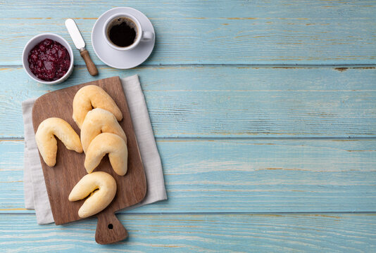 Chipas, typical south american cheese bun with coffee, jam and copy space