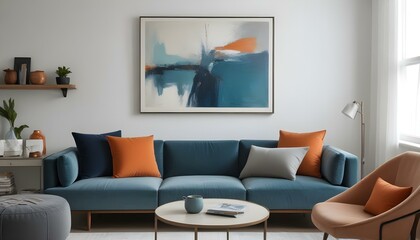 A large abstract painting in shades of blue and teal hangs on the wall above a gray sectional sofa with orange and gray throw pillows.