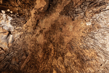 Looking up at the ceiling with stalactites. Natural photo
