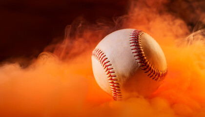 Baseball ball in orange smoke on dark backdrop. Sport game concept. Close-up.