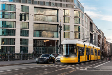 Scenic evening view Weidendammer bridge street and yellow  tram train bridge in Berlin Mitte central district at dusk sunset. Urban european transport commute cityscape Germany scene background © Kyryl Gorlov