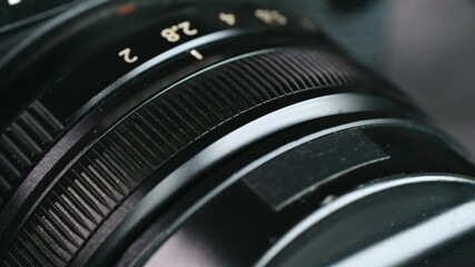 Photographer wipes down modern camera using soft brush. Professional preserves camera functionality and clarity for capturing perfect images