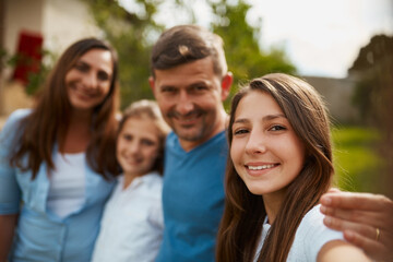 Portrait, family selfie and happy kids outdoor with parents for love, pov and support for connection. Face, profile picture and mother with father, children and girls together at park for holiday