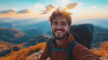 Naklejka premium Man Smiling On Top Of Mountain