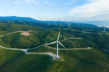 Wind turbines energy generator zero emission Carbone in the green hills, alternative energy sources...