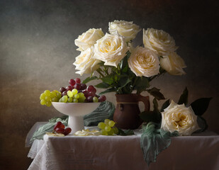 Still life with a bouquet of white roses and grapes on a dark background