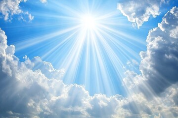 Light rays or beams of sun bursting through clouds. Blue sky with religious symbolism.