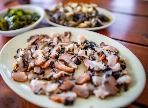 Close-up of food raw sting winkle fresh on dish at a sushi restaurant of Udo Island at Jeju-si, Jeju-do, South Korea 
