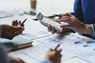 Business adviser meeting to analyze and discuss the situation on the financial report in the meeting room. Investment Consultant, Financial Consultant, Financial advisor and accounting concept.