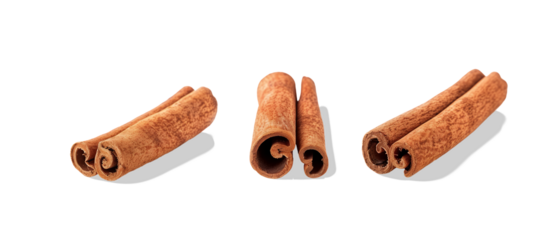 Three cinnamon sticks isolated on black.
