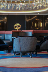 Gold Brass globe inside wood paneled Art Deco interior design architecture inside lounge bar public...