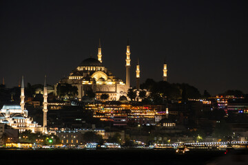 Istanbul skyline with Eminonu district and Suleymaniye mosque as seen across the Golden Horn at night