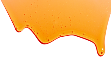 flowing yellow liquid on empty background. Honey, caramel, cosmetics