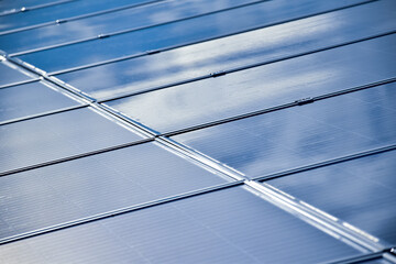 Closeup solar rooftop panels which are clean and clear after washing, soft focus, maintenance concepts, new edited.