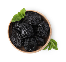 Tasty dried plums (prunes) and mint leaves in bowl on white background, top view