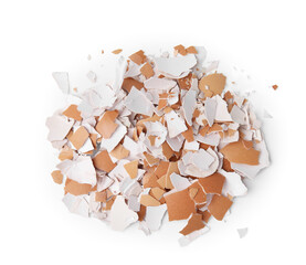 Pile of broken eggshells isolated on white, top view