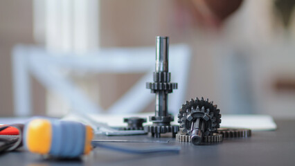 The gear set is placed on the workbench of a team of factory mechanical engineers to study and design the working system of the mechanical gearbox in the factory to complete the production.