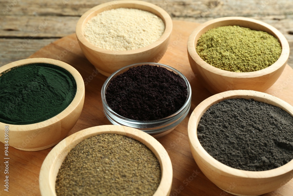 Canvas Prints Different superfood powders in bowls on table, closeup