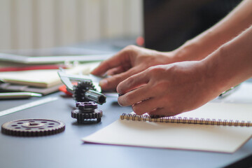 Fototapeta premium The factory mechanical engineering team is designing and developing gear sets to keep the machines running perfectly because gear sets are essential in the working system of large machines.