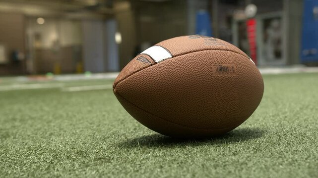 Football on indoor turf field stadium