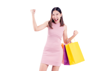 Joyful woman celebrates while holding vibrant shopping bags against a matching pink background. The image captures the excitement and satisfaction of a successful shopping experience