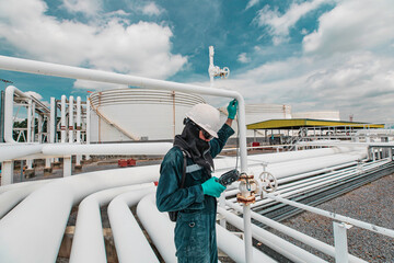 Male worker inspection and measurement thickness pipeline oil and gas at check record pipeline