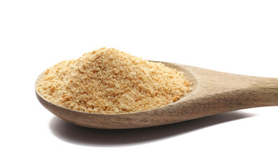 Ground, minced biscuit, pile crumbs in wooden spoon isolated on white, side view