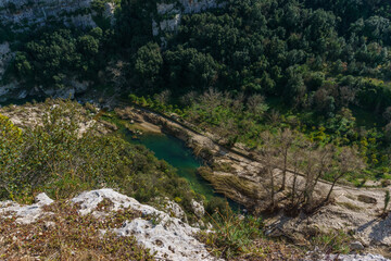 View of canyon of the Anapo valley with river at the nature reserve Pantalica with flood damage, Siracusa, Sicily, Italy