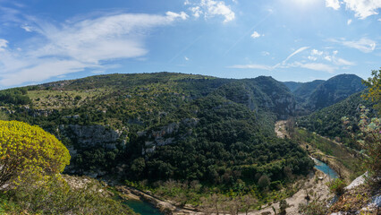 Panoramic view down the canyon of the Anapo valley with river at the nature reserve Pantalica, Siracusa, Sicily, Italy