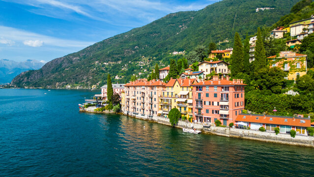 An aerial view of Bellano, a picturesque village on the eastern shore of Lake Como, Italy, captured by a drone. This charming lakeside town is known for its stunning scenery, narrow streets