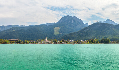 landscape with Lake Wolfgangsee, mountains and the town of Strobl, Austria