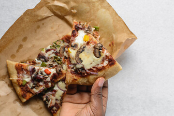 Overhead view of chicken mushroom pizza slice, top view of sliced beef and mushroom pizza